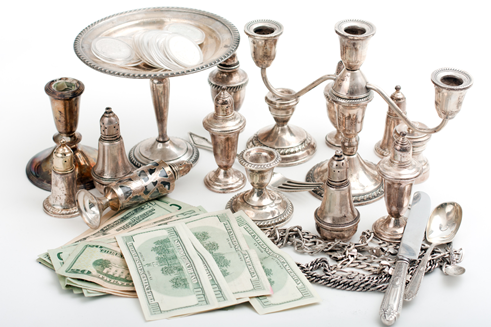 A sterling silverware candle set with cash - sterling silver flatware